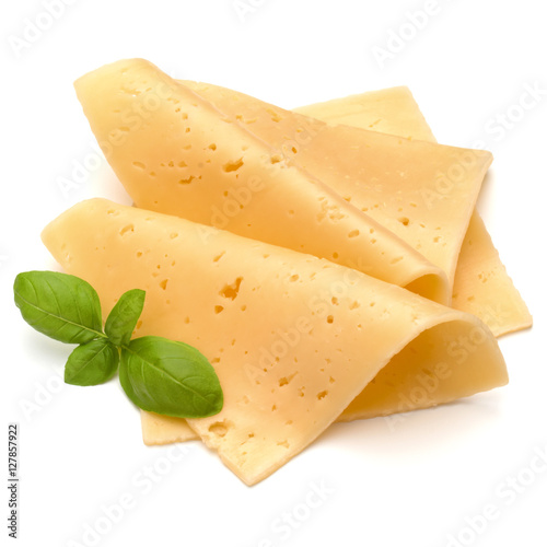cheese slices and basil herb leaves isolated on white background