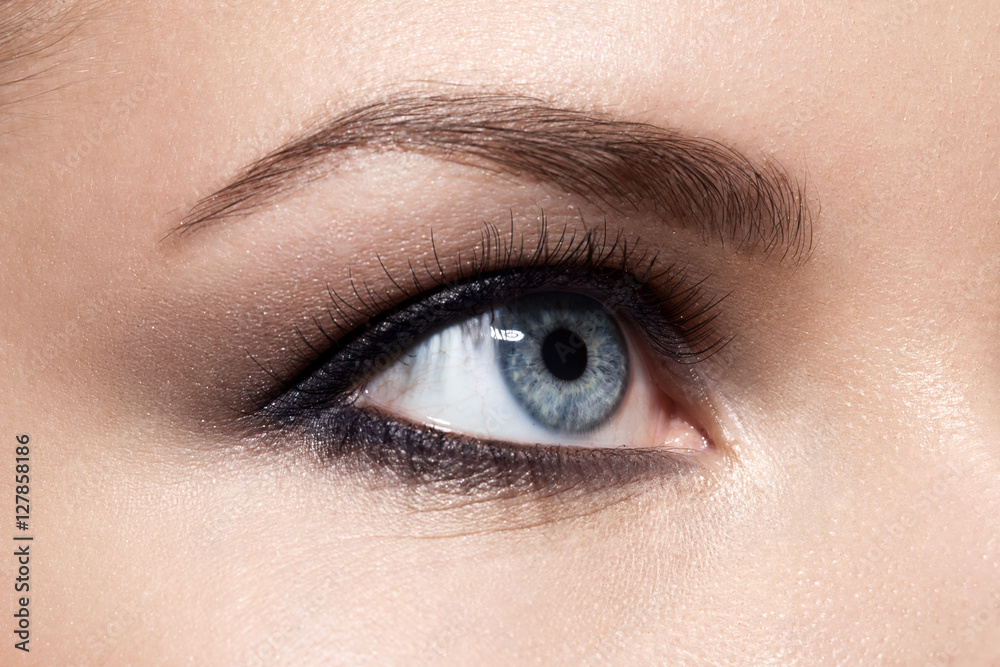 Fototapeta premium Close-up of make up smoky eyes for blue eyes with, long eyelashes and brown eyebrows