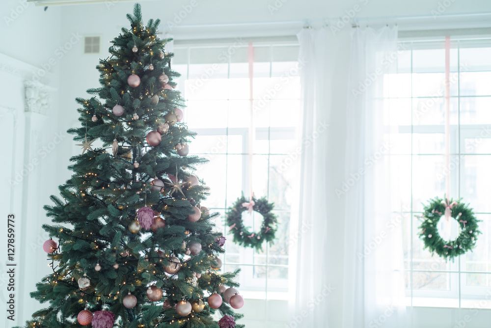 Christmas decorations with christmas tree and gifts in white living room Christmas decorations with christmas tree and gifts in white living room