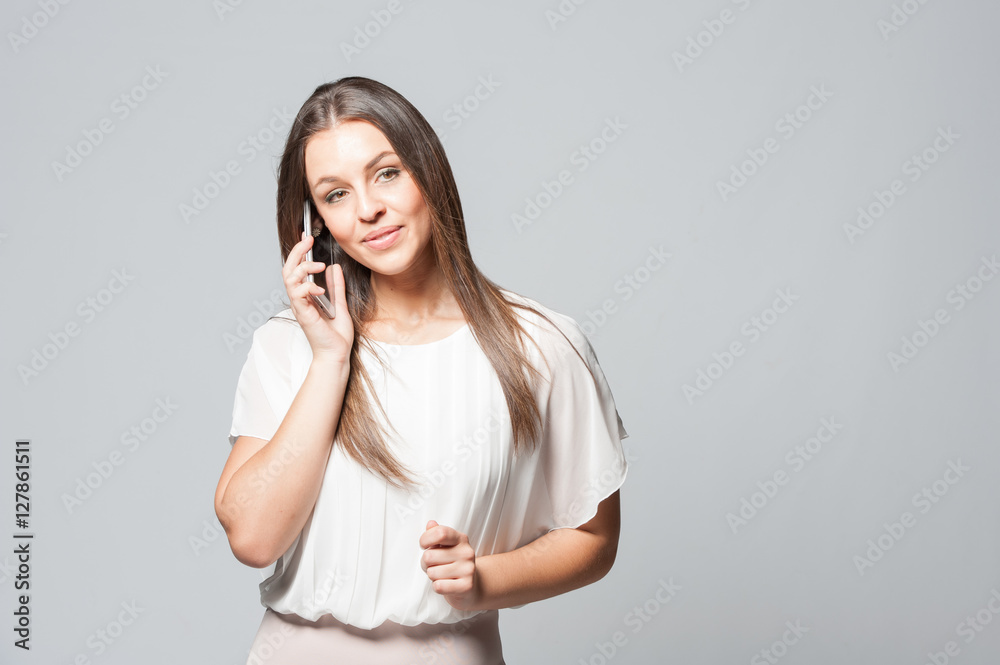 Portrait of smiling young business woman holding a phone Portrait of smiling young business woman holding a phone