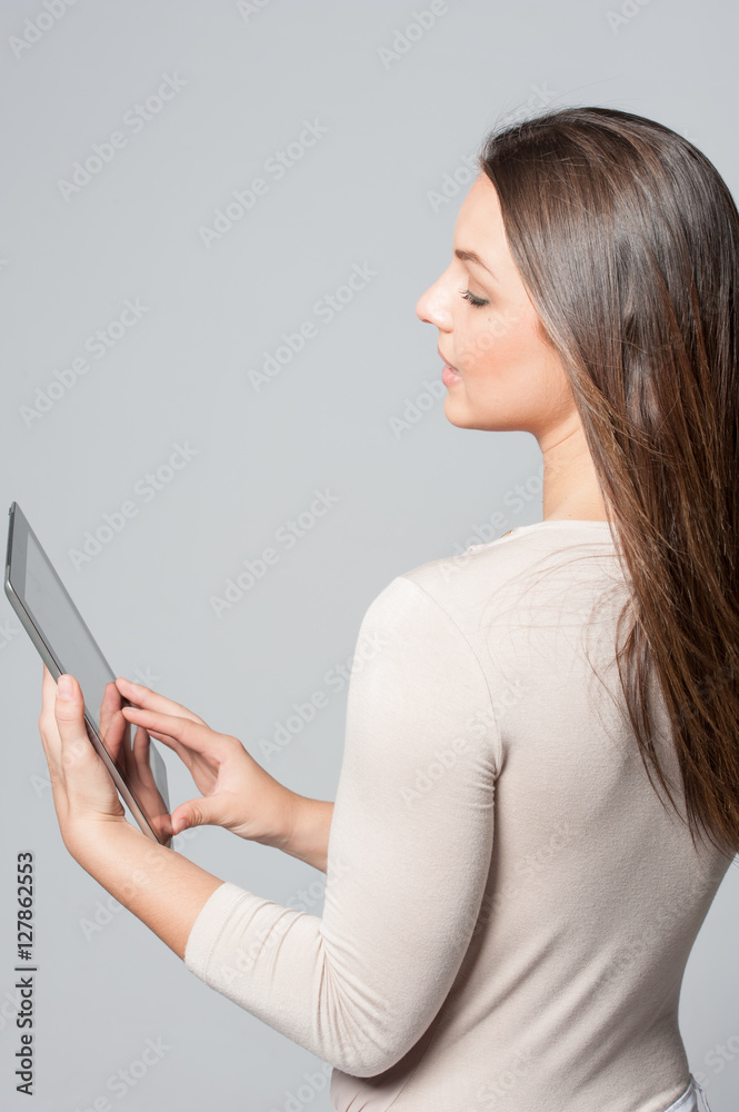 Portrait of smiling young business woman holding a tablet Portrait of smiling young business woman holding a tablet