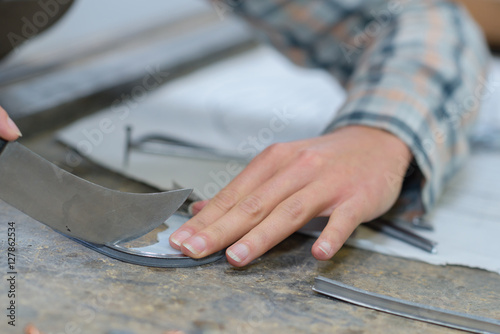 man carving with knife