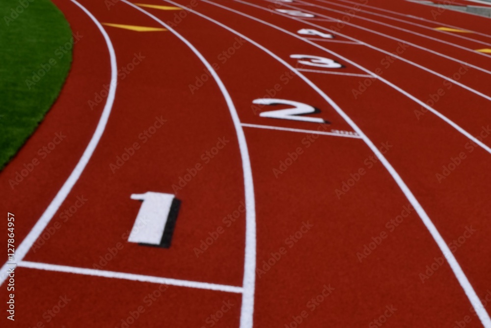 Staggered Track Lanes / Numbered track lanes on a curve. Stock Photo