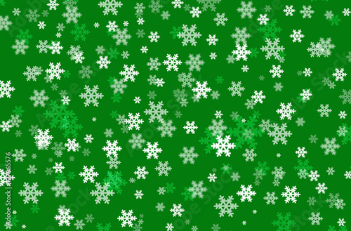 Snowflakes on green background 