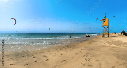Lifeguard watchs the kitesurfers in Canary Islands