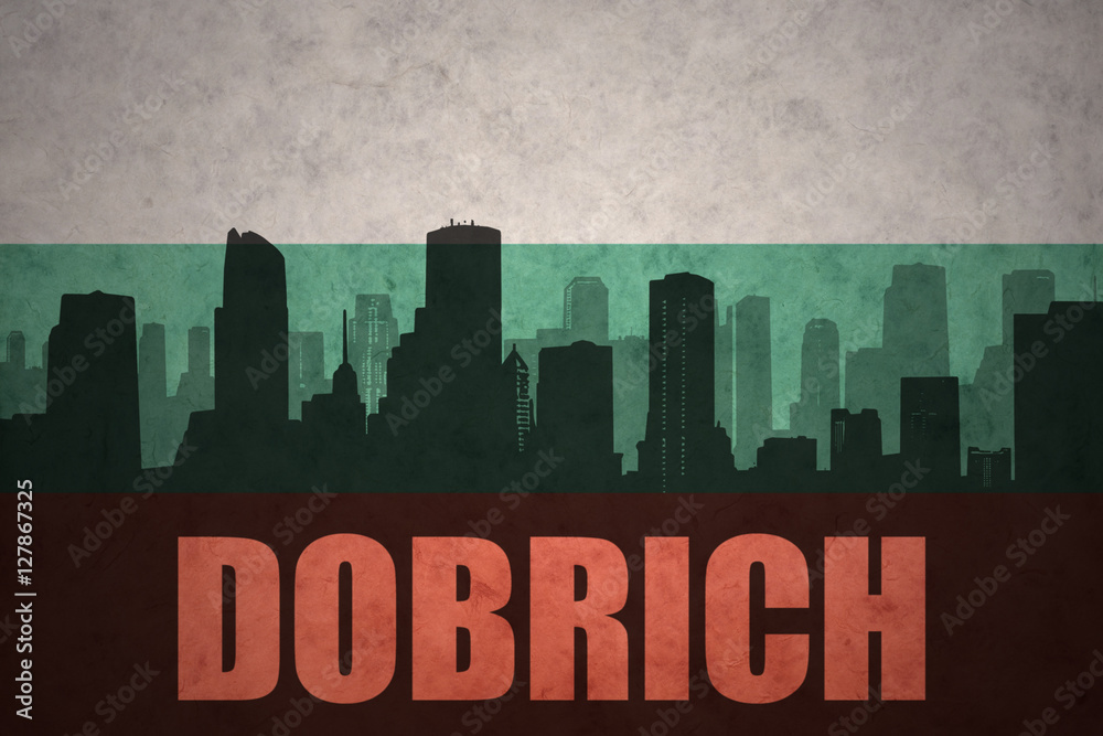 abstract silhouette of the city with text Dobrich at the vintage bulgarian flag