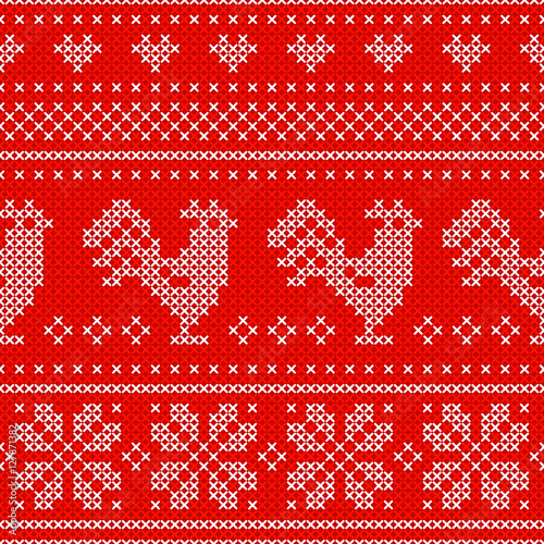 Red Holiday seamless pattern with cross stitch embroidered roosters.