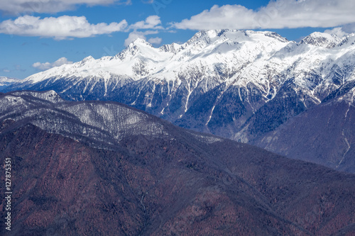 Beautiful mountain scenery of the Main Caucasian ridge with snowy peaks at winter photo