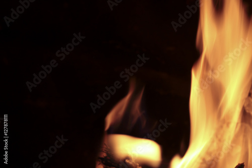Flames of fire in a fireplace. Shooting horizontal with tones Orange and black. © FRANCISGONSA