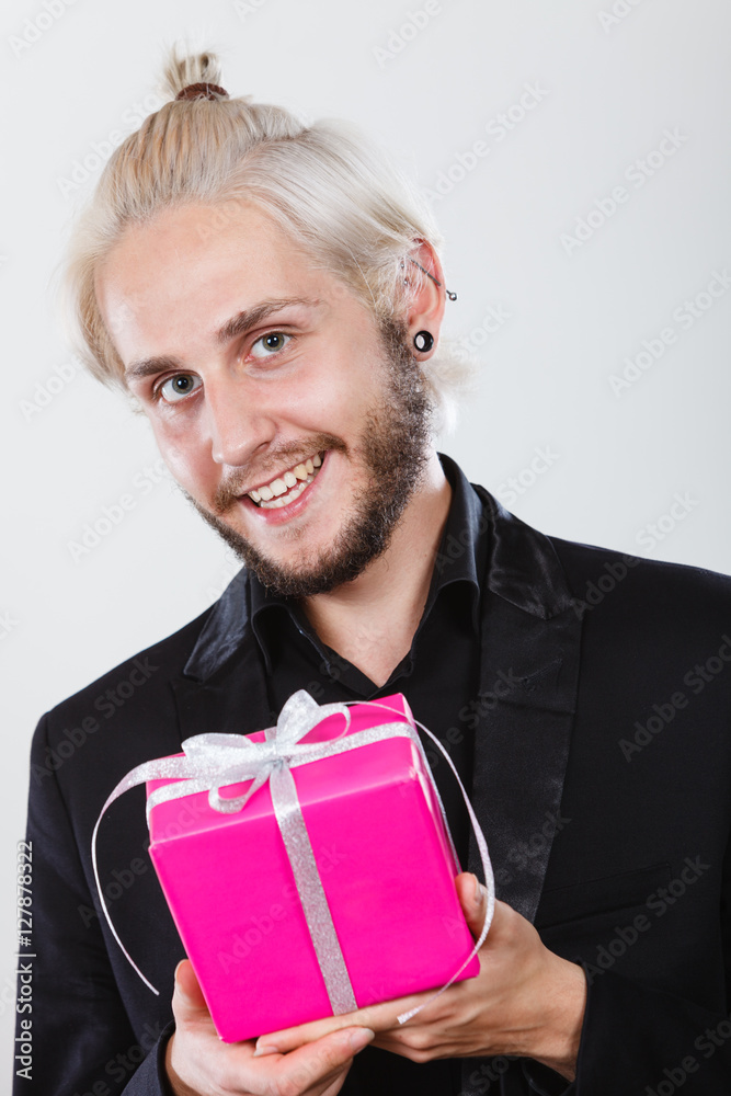 man holding present pink gift box in hand man holding present pink gift box in hand