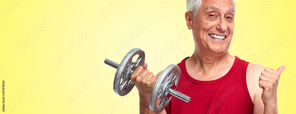 Naklejka premium Senior man with dumbbell.