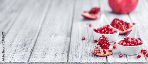Wooden table with Pomegranate (selective focus)