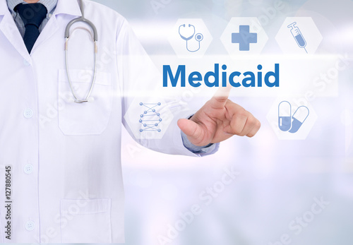 Medical insurance and Medicaid and stethoscope. photo