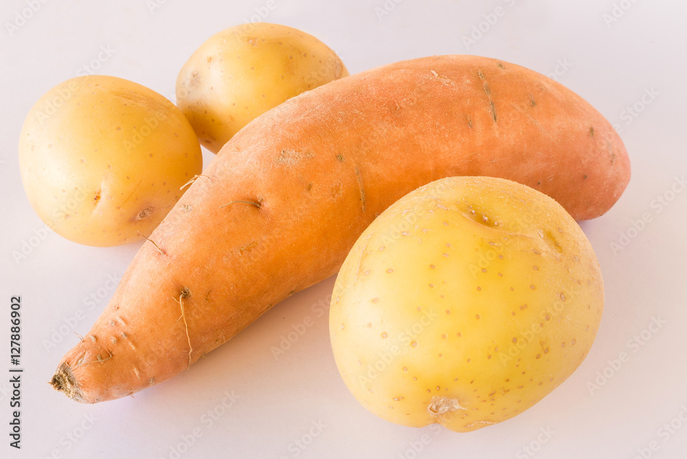 Sweet potato and raw potatoes on white background Sweet potato and raw potatoes on white background