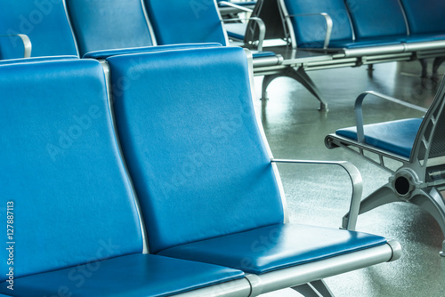 Rows of empty chairs at airport in city of China.