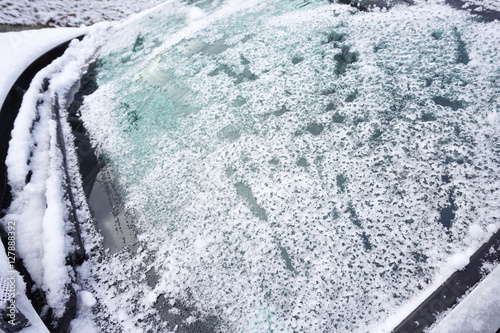 removing snow and ice on the car windshield