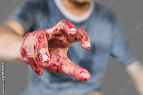 Bloody theme lone murderer: the murderer shows bloody hands and