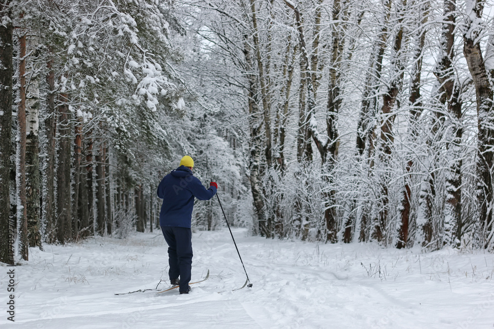 winter snow sport man run in tree park