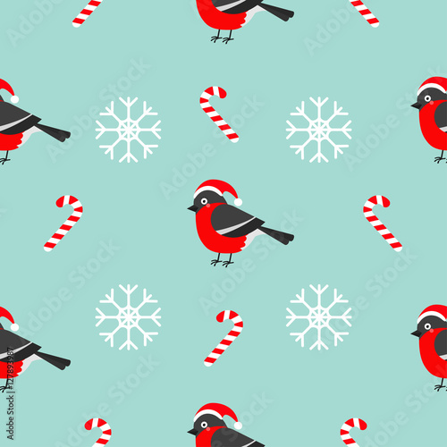 Christmas snowflake candy cane, bullfinch bird wearing red santa hat. Seamless Pattern Decoration. Wrapping paper, textile template. Blue background. Flat design.