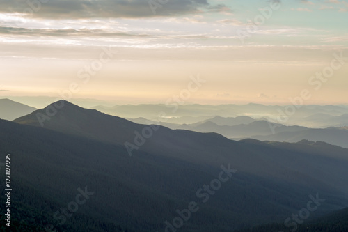 CARPATHIANS, UKRAINE - JULY 5, 2016: At the top of the Carpathian Mountains. Beautiful landscape at sunset © firairo