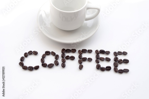isolated white cup of coffee and coffee beans on white backgroun
