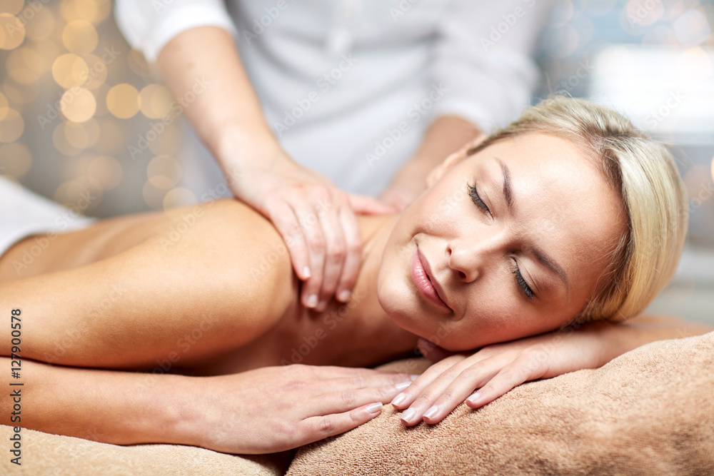 Fototapeta premium close up of woman lying and having massage in spa