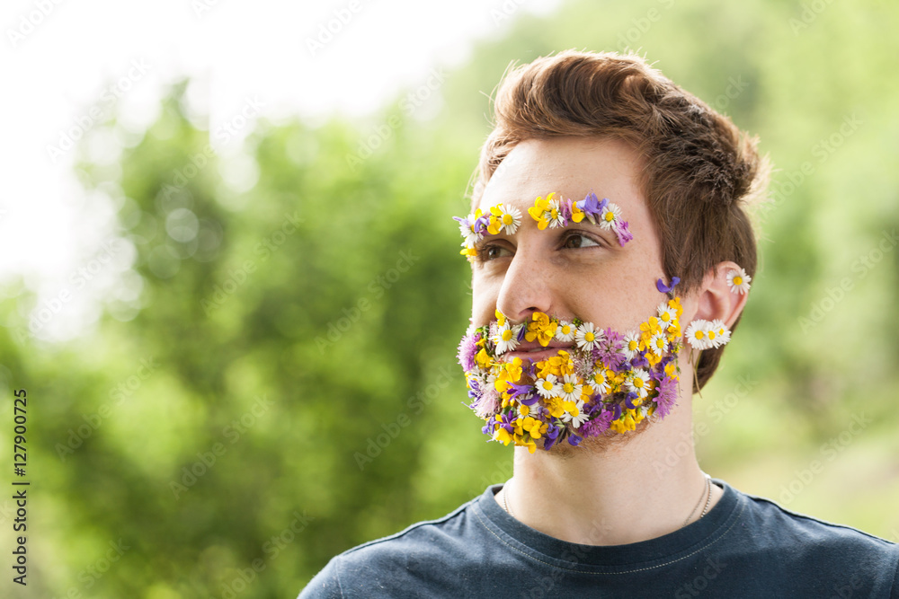portrait of a guy with flowers instead of his beard - obrazy, fototapety, plakaty 