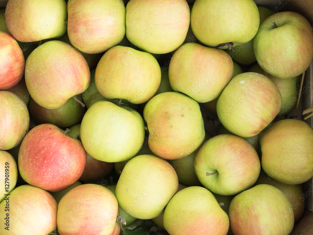 Background of green and red apples close up. Green and red apples pattern on sale at the market. Background of green and red apples close up. Green and red apples pattern on sale at the market.