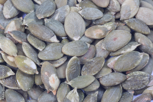Dried pumpkin seeds isolate on white

