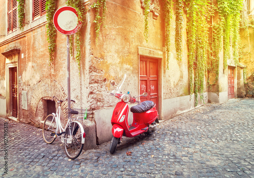 Fototapeta Naklejka Na Ścianę i Meble -  old town italian street with byke in Trastevere with sunshine, Rome, Italy