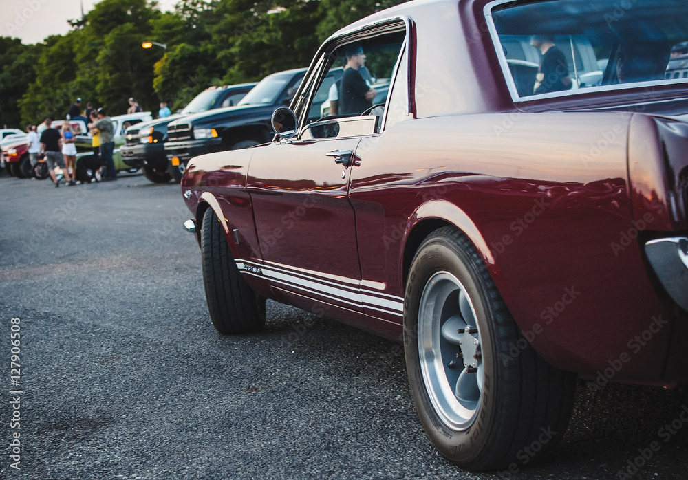 Large American car stands on the street in the evening Large American car stands on the street in the evening