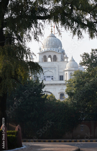 Sacred place of Sikhs - Rakab Ganj Sahib, Gurudwara in Delhi. The beautiful white building in the Delhi center, one of the main places of worship of Sikhs - Gurdwara Rakab Ganj Sahib.  photo