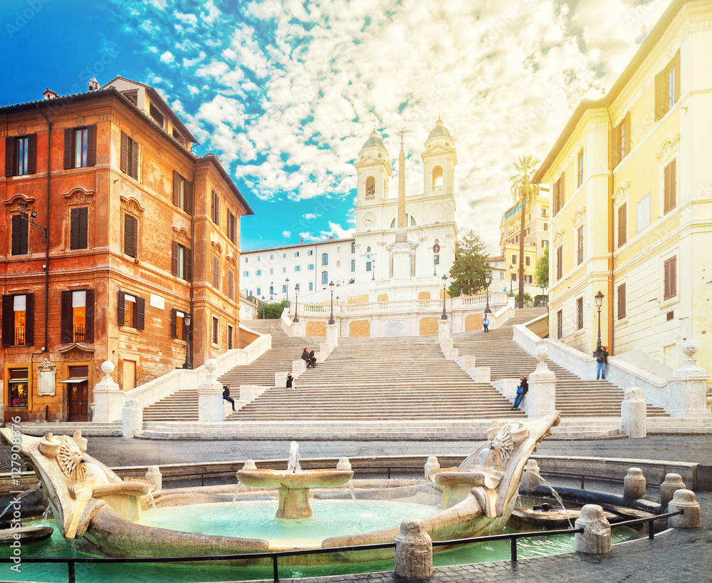 famous Spanish Steps with fountain with sunshine, Rome, Italy