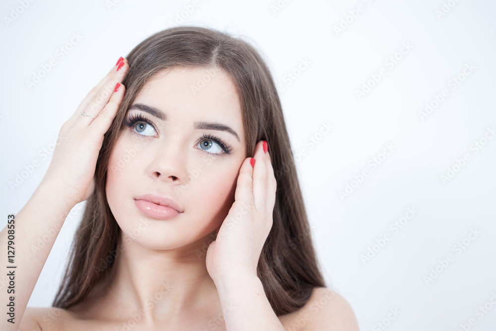 Beautiful Young Woman with Fresh Clean Skin touch own face. Cosmetology, beauty and spa. Beautiful Young Woman with Fresh Clean Skin touch own face. Cosmetology, beauty and spa.