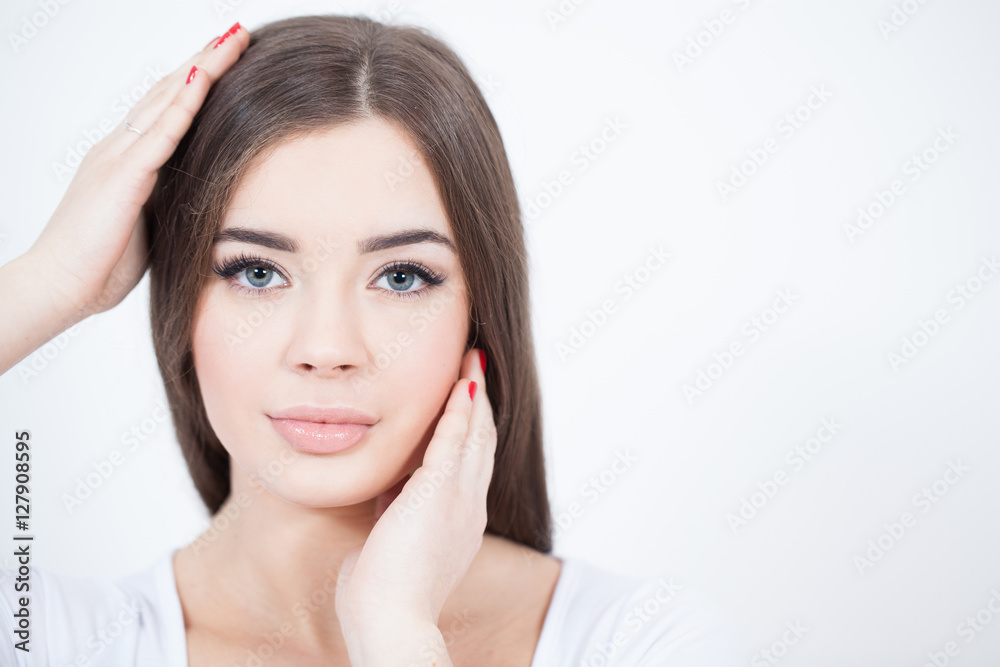 Beautiful Young Woman with Fresh Clean Skin touch own face. Red lips, red lipstick. Cosmetology, beauty and spa. Beautiful Young Woman with Fresh Clean Skin touch own face. Red lips, red lipstick. Cosmetology, beauty and spa.