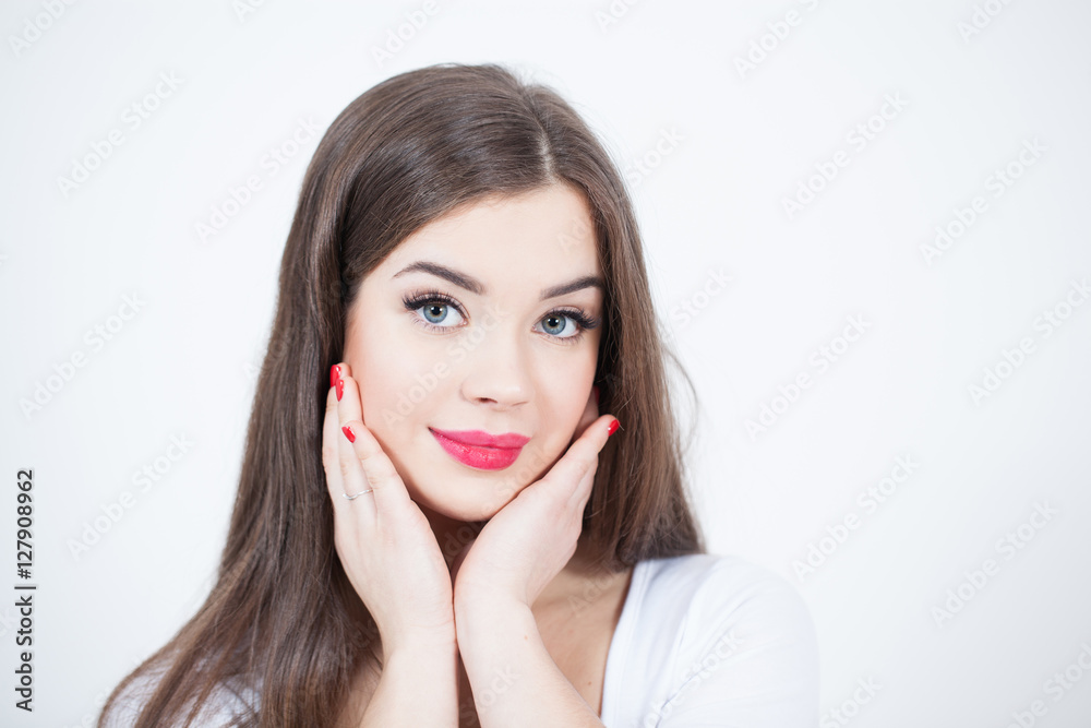 Beautiful Young Woman with Fresh Clean Skin touch own face. Red lips, red lipstick. Cosmetology, beauty and spa. Beautiful Young Woman with Fresh Clean Skin touch own face. Red lips, red lipstick. Cosmetology, beauty and spa.