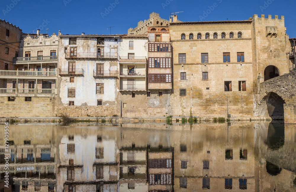 Historical houses with reflection in the river in Valderrobres