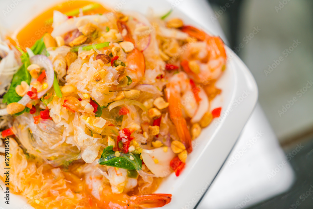 Spicy noodles with shrimp and vegetables . Spicy noodles with shrimp and vegetables .
