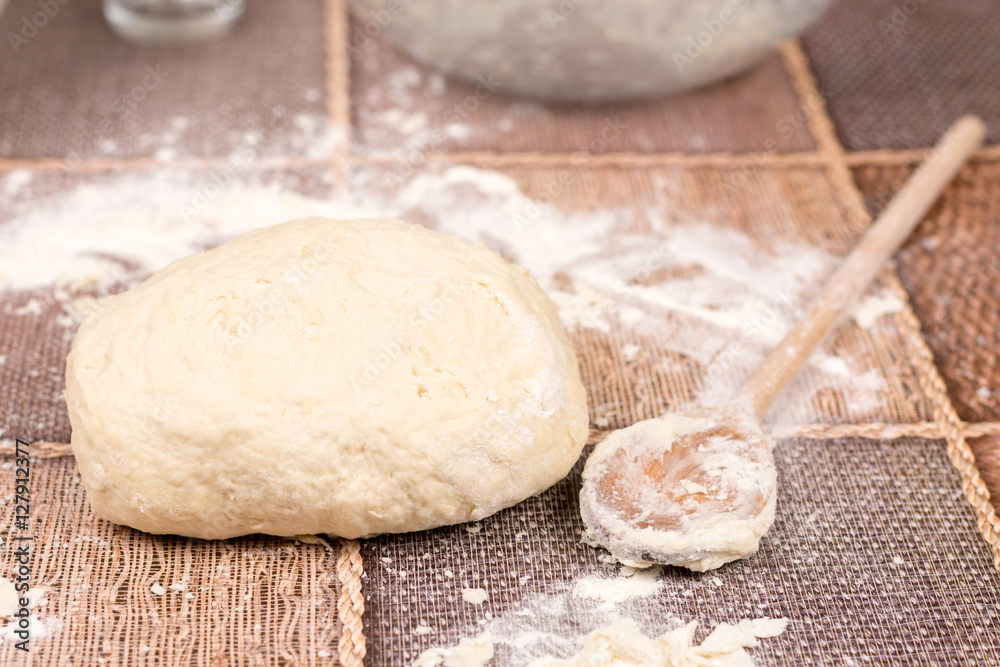 Fototapeta premium Prepared pizza dough on the table