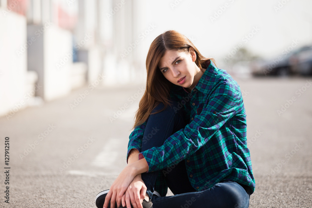 Fototapeta premium Urban fashionable girl posing outdoors in the city