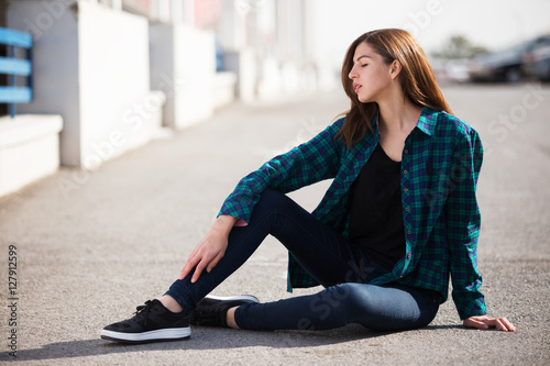 Urban fashionable girl posing outdoors in the city