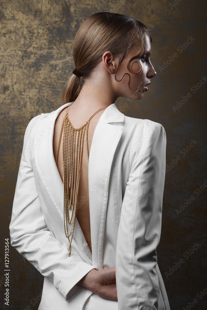 Studio portrait of attractive woman with gold make-up and wet ha Studio portrait of attractive woman with gold make-up and wet ha
