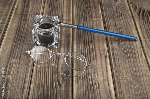 old glasses and pen