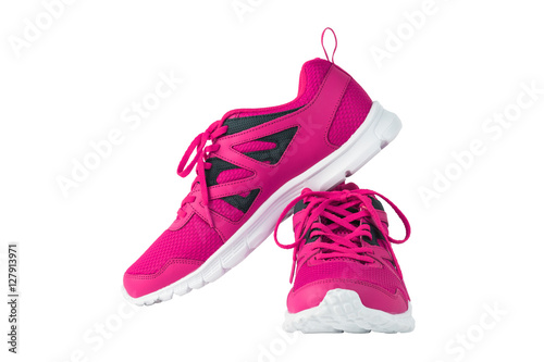 Pink sport running shoes isolated on white background