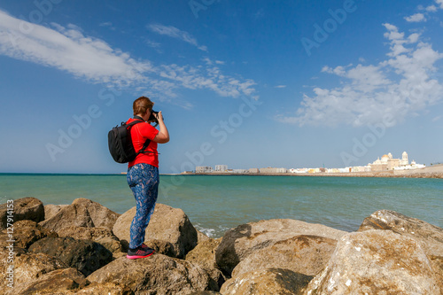 Cadiz. A scenic view of the city from the breakwater on the beach. © pillerss