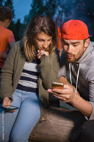 Guy and girl watch mobile