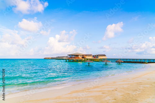 Fototapeta Naklejka Na Ścianę i Meble -  Beautiful water villas in tropical Maldives island at the sunris