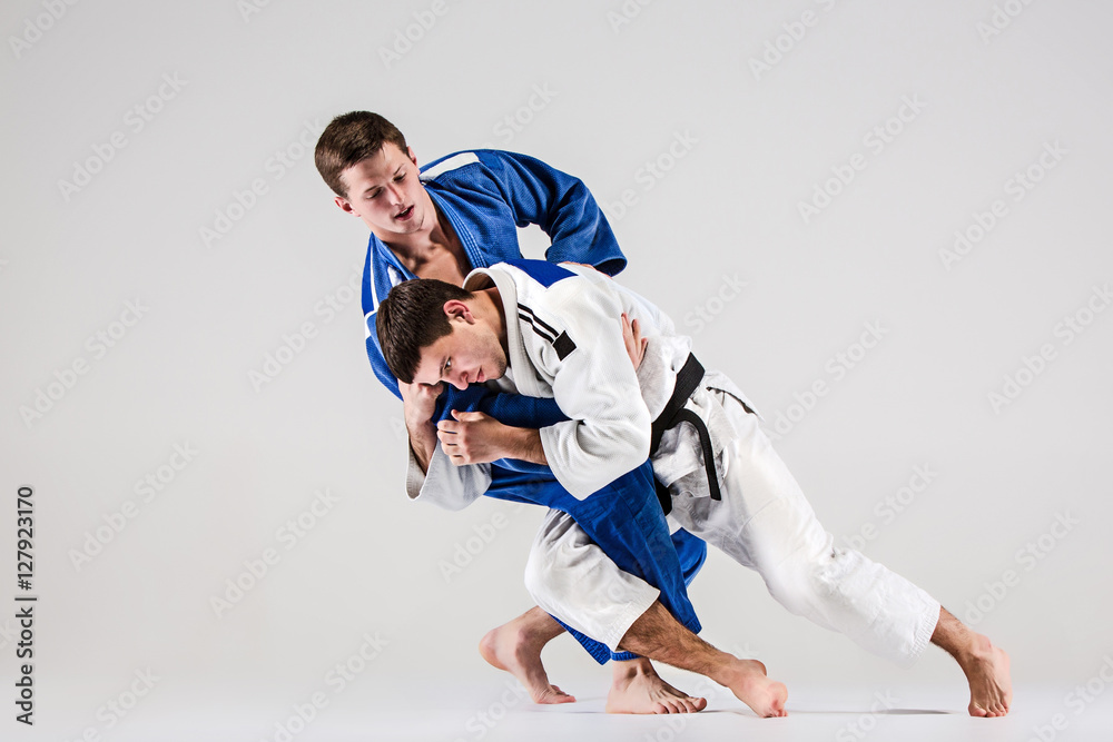 The two judokas fighters fighting men The two judokas fighters fighting men