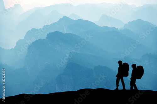 Climbers in the mountain range background