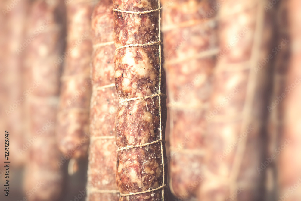 high quality salami hanging in cellar high quality salami hanging in cellar